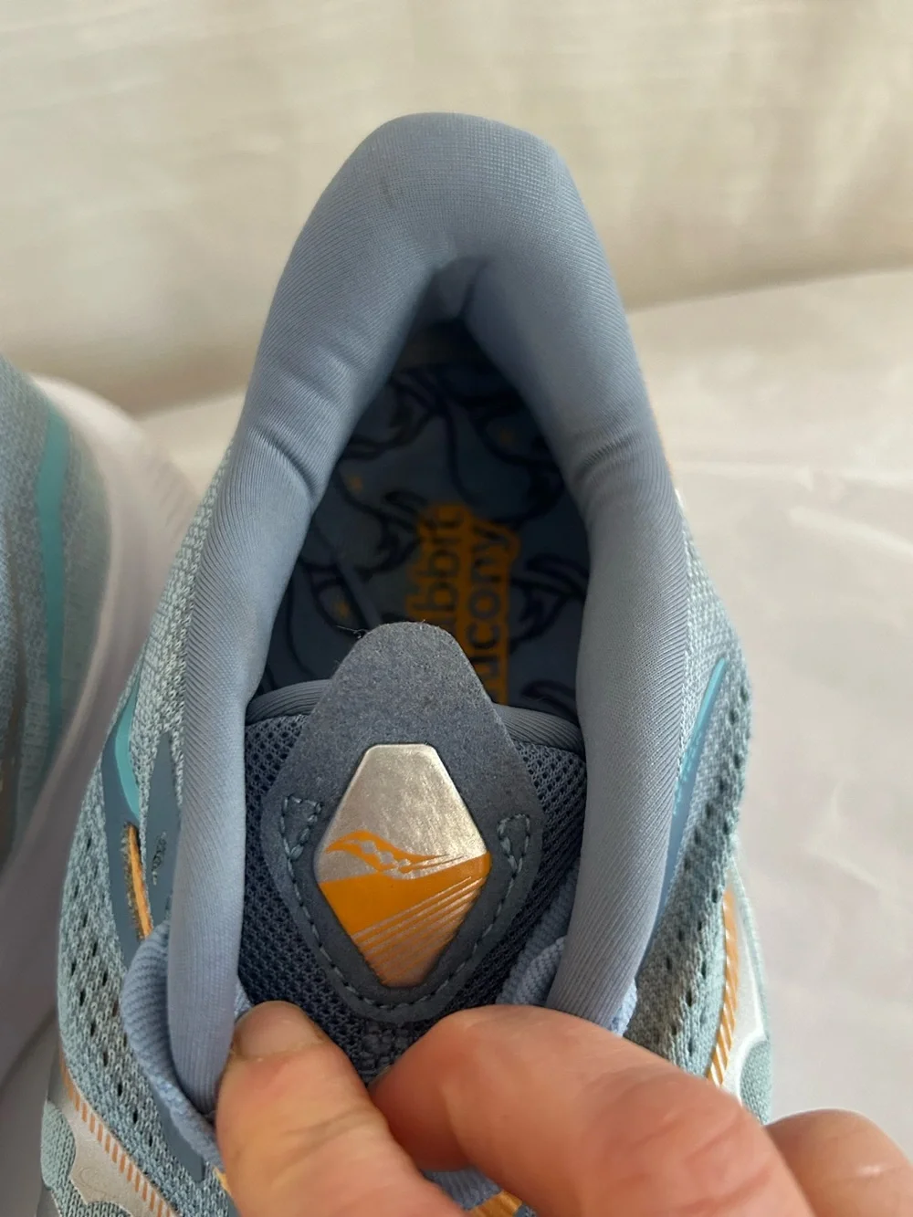 Saucony Ride 15 Women's Light Blue Athletic Sneakers with Yellow Accents